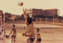 An IIT Madras volleyball player spikes the ball, 1985