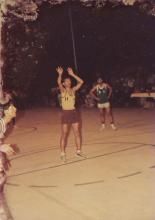 An IIT Madras basketball player shoots a free throw, 1985