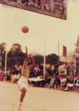 A basketball player shoots a ball, 1985