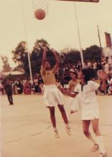 A girl takes a jump shot during a basketball match at IIT Delhi 1985
