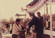 A student receives a trophy at the 22nd Inter-IIT Sports Meet, 1985