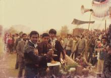 A person poses with a trophy at IIT Delhi, 1985