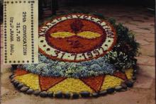 A photograph of the IIT Madras emblem decorated with flowers, 1992