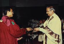 Dr. P. Rama Rao presents a degree certificate to a graduand, 1992