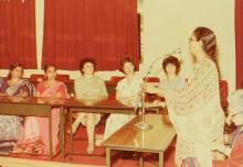 A woman addresses a gathering at IIT Madras