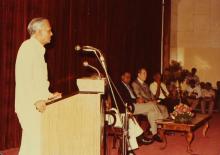 A speaker addresses an audience at IIT Madras