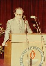 A speaker addresses an audience at IIT Madras