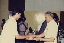 Prof. L. S. Srinath presents an award to a student, 1988