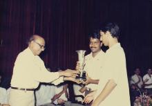 A trophy is presented to a person during the 29th Institute Day, 1988