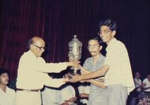 Students receive a trophy at the 29th Institute Day, 1988