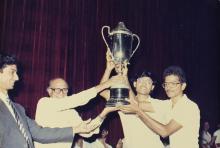 Students receive a trophy at the 29th Institute Day, 1988