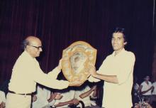 A person receives a shield during the 29th Institute Day, 1988