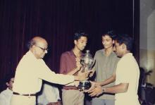 Students receive a trophy at the 29th Institute Day, 1988