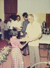 A young girl receives an award at the 29th Institute Day, 1988