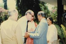 Prof. L. S. Srinath greets Dr. Konrad Seitz outside the Bose-Einstein Guest House, 1988