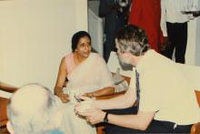 Mrs. Pushpa Srinath interacting with a guest over refreshments, 1988