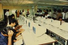 Students working on the new terminals, 1988