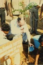 Dr. Konrad Seitz waters a sapling at IIT Madras, 1988