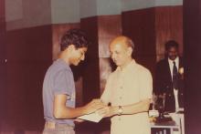 A student receives a prize, 1994
