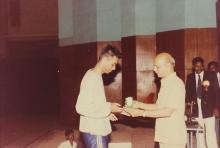 A student receives a prize, 1994