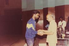 A student receives a prize, 1994