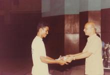 A student receives a prize, 1994