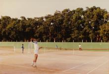 A tennis players tosses up a ball to serve, 1994