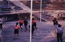 A basketball player takes a shot, 1999