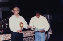 A student receives a prize, 1999