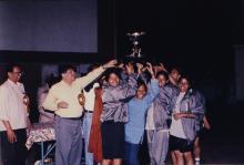 Hoisting a trophy, 1999