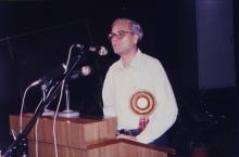 A gentleman addresses the audience at IIT Madras, 1999