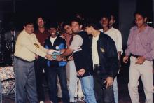 Prof. R. Natarajan presents a prize to a group of students, 1999