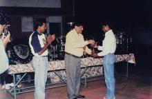 Prof. R. Natarajan presents a trophy to a student, 1999