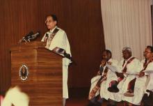 Mr. K. L. Chugh, Chairman of ITC Limited, Calcutta, addresses the audience during the 30th Convocation, 1993.  The Registrar, Mr. V. Shanmugam is seated to the extreme left.
