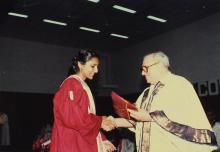 Dr. Russi Mody congratulates a prize winner at the 26th convocation