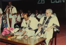 Mr. A. L. Mudaliar signs the register of degrees at the 26th convocation