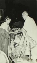 A student receives her degree 