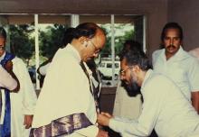 Mr. A. L. Mudaliar is helped with his convocation robes, 1989