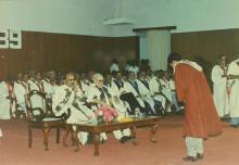 Student bowing down before receiving degree at the 26th Convocation, 1989