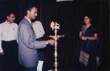 A student representative lights the kuthuvizhaku