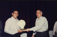 The Director gives the chief guest a memento 