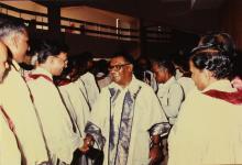 The chief guest greets members of the board of governors and faculty