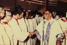 The chief guest greets members of the board of governors and faculty
