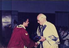 The chief guests congratulates a prize winner