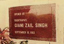 A photograph of the stone slab that marks the inauguration of the Student Activities Centre, 1983