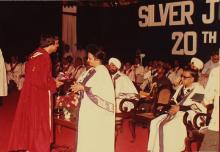 A graduand receives his degree, 1983