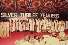 Distinguished guests, administrators and faculty standing for the national anthem, 1983