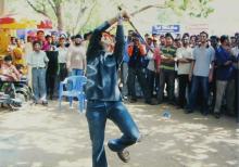 A student tries to hit a pinata during an event at Saarang