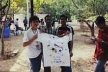Students hold up a hand-painted T-shirt, Saarang 2005