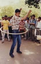 A young man hula hoops at Saarang, 2003
